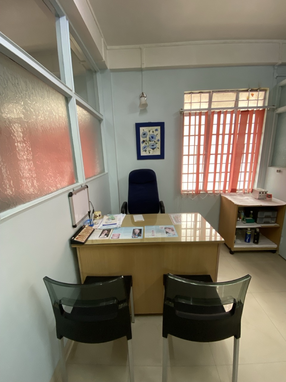 Consultation room interior with desk and seating