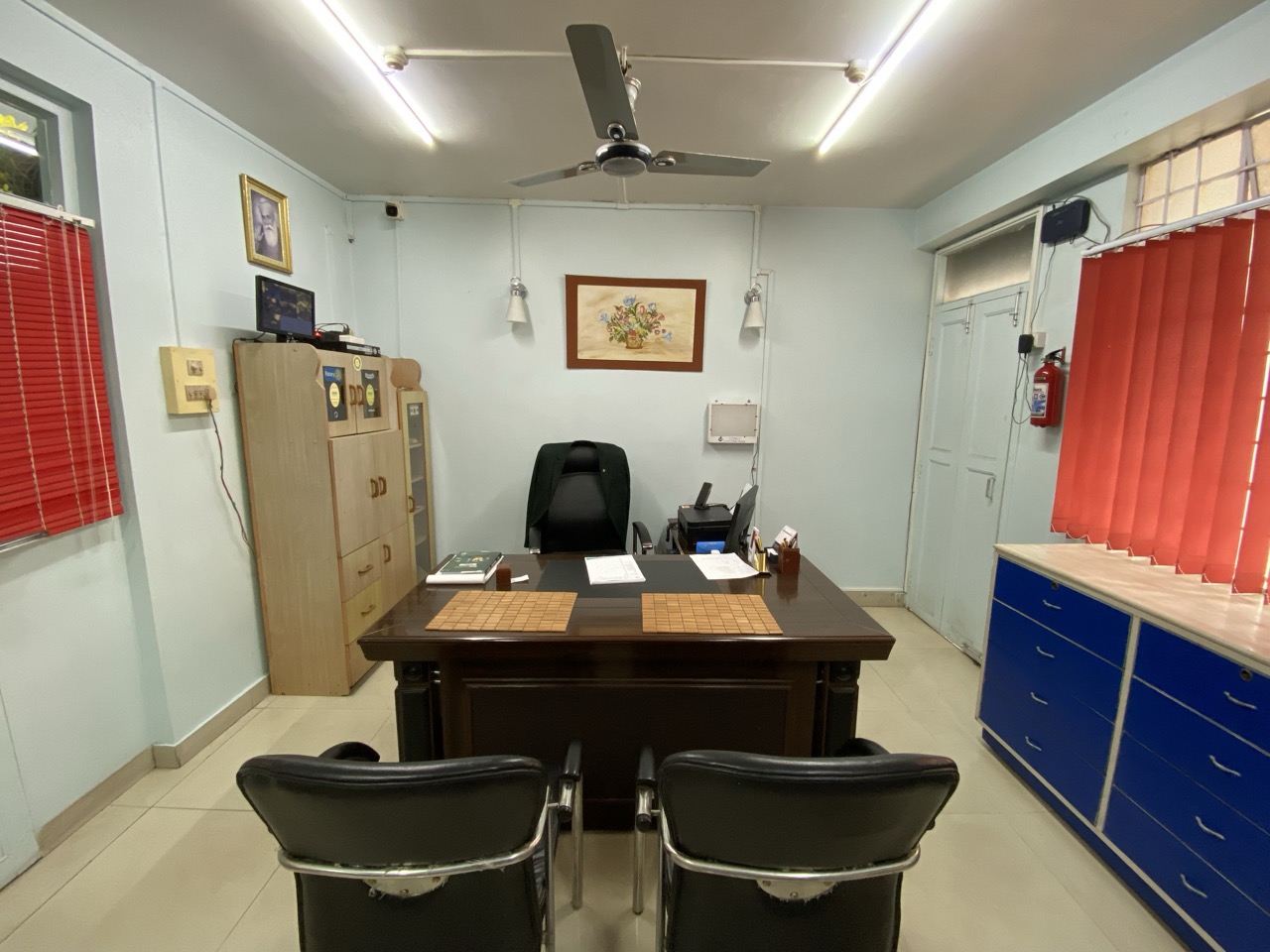 Consultation room with desk and chairs for patient discussion