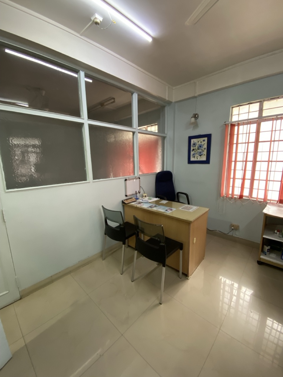 Consultation room with treatment chair visible