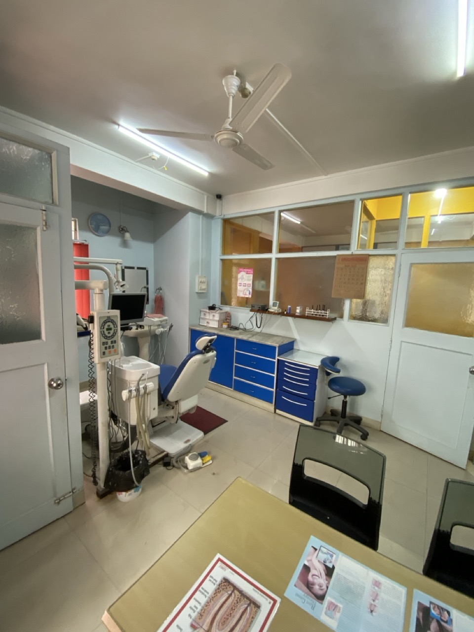 Dental procedure in progress in consultation room