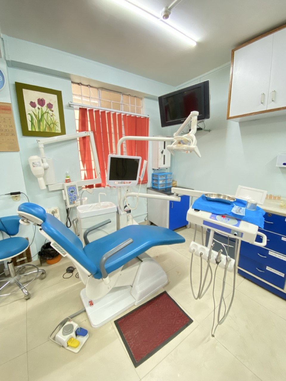 Dental chair and equipment setup inside treatment room
